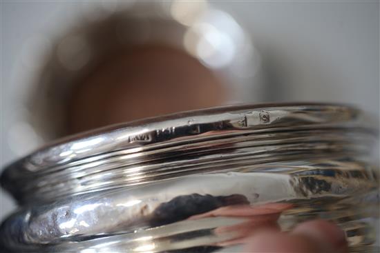 A pair of George III Irish silver mounted wine coasters and one other similar coaster, 17.3cm.